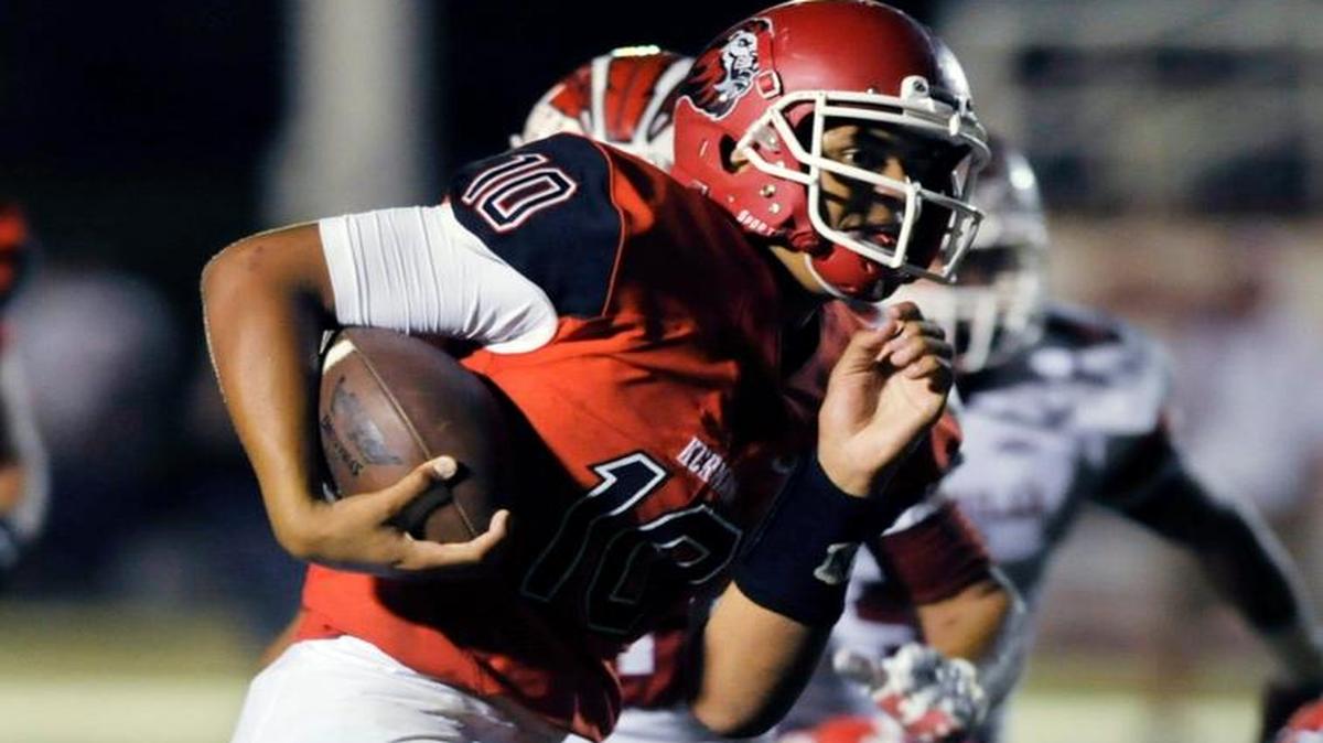 Kerman’s Sean Chambers runs for yardage against Chowchilla Friday night, October 9, 2015 in Kerman. The senior verbally committed to Rutgers on Saturday, June 17, 2017.