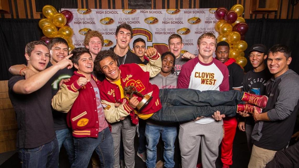 Clovis West High senior Caleb Kelly is celebrated by teammates after receiving the high school Butkus Award honoring the nation’s top prep linebacker. The award was presented at a surprise event before coaches, players and family at a team meeting Thursday involving Pro Football Hall of Fame linebacker Dick Butkus via telephone and his son, Matt, who was on hand to present the trophy.