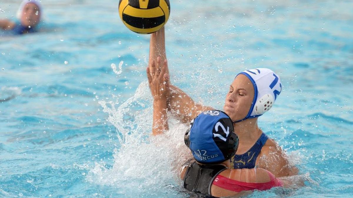 Clovis’ Shelby Vidmar tries to get a shot past Clovis North’s Tatum Scarry during their Tri-River Athletic Conference girls water polo match in October. Clovis was in action Tuesday in the Northern California regional Division I playoffs, at Leland-San Jose and fell 10-4.