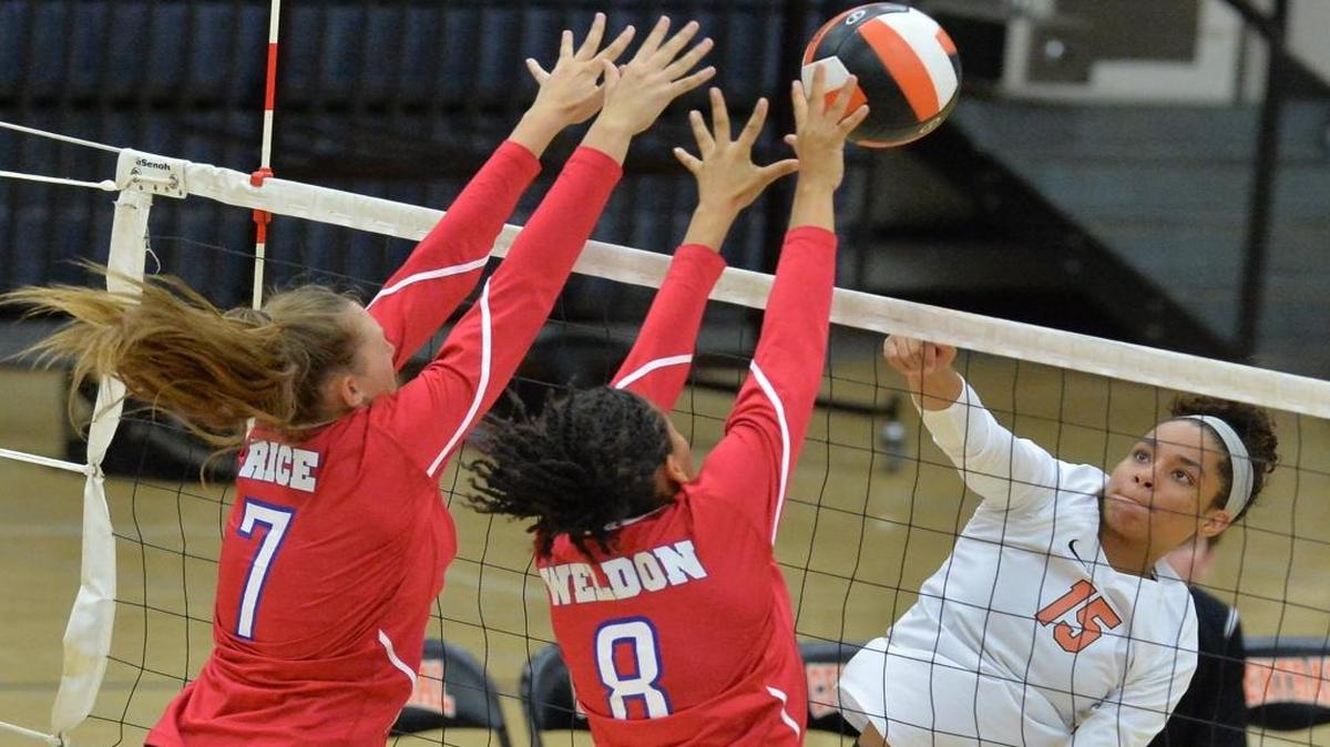 Buchanan’s Kennedy Rica, left, and Amaya Weldon go up against Central’s Maya Riddlesprigger in a 2016 match. The programs meet again Tuesday night as the Central Section’s top two teams. Weldon and Riddlesprigger are each back as seniors.