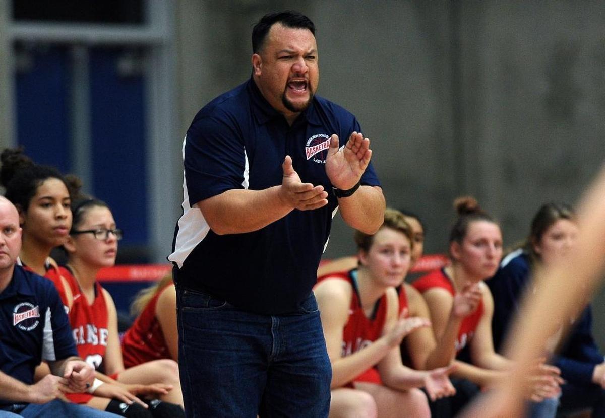 Sanger High coach David Campbell urges on his Apaches as they take on Kerman at the Old Town Clovis Kiwanis Classic on Saturday, Dec. 30, 2017 in Clovis. Sanger beat Kerman 57-55 to capture the title.
