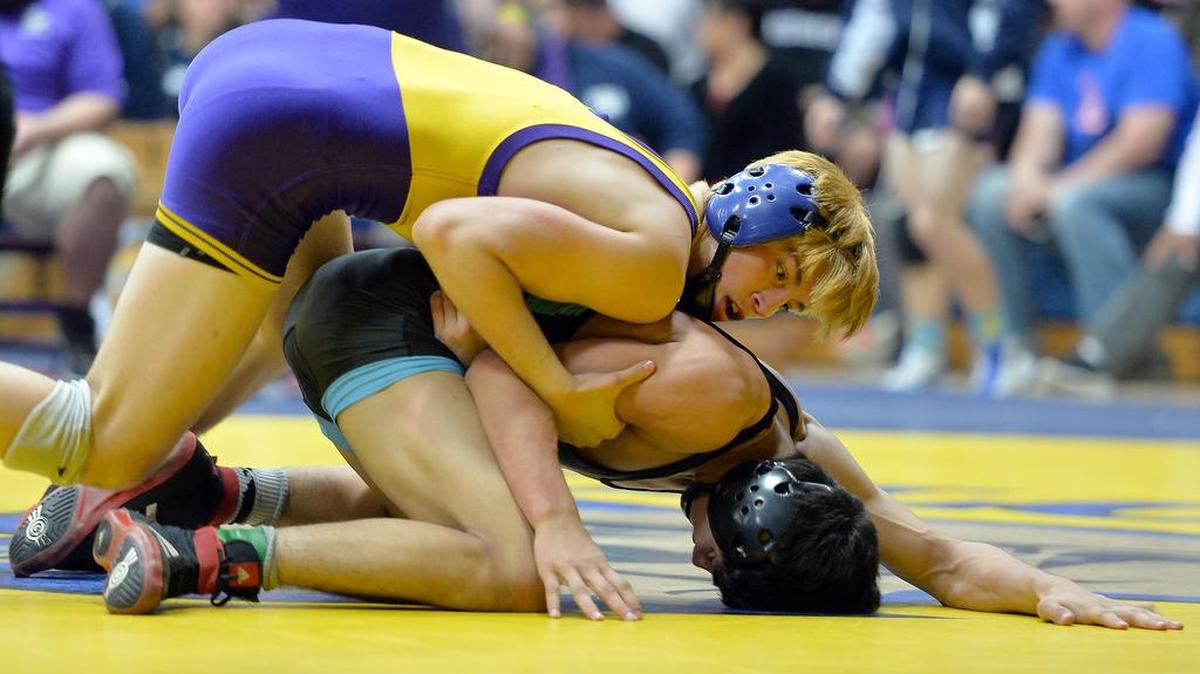 Lemoore’s Gary Joint, at left competing against Clovis North’s Chris Deloza in the Yosemite Divisionals on Feb. 20, finished third at 126 pounds in the CIF State Wrestling Championships on Saturday.