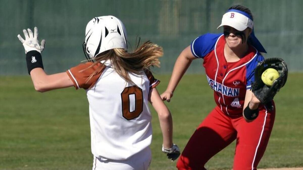 Buchanan’s Claire Buckley, right, tags out Central’s McKenzie Miller caught between second and third base during the 2018 Clovis Easter Classic softball semifinals Tuesday, March 27, 2018 in Clovis.