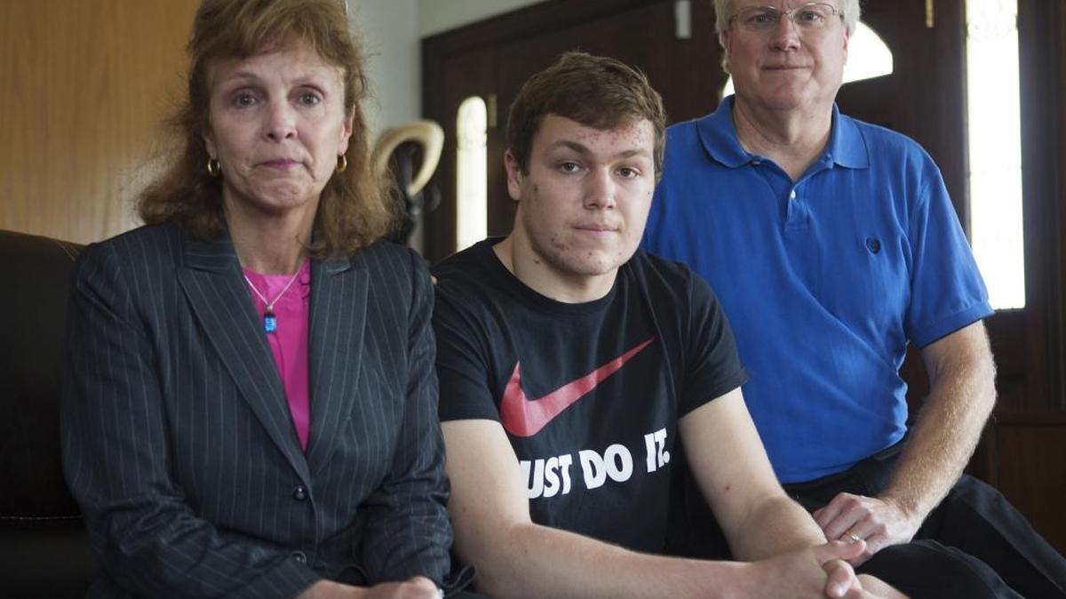 Blake Flovin, with parents Rena and Rick in their Sunnyvale home, wants to see a postponement of the CIF State Wrestling Championships this weekend out of fear the Mitty High-San Jose senior may have passed on the herpes virus to other athletes.