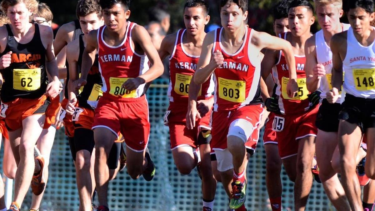 Kerman High breaks out from the starting line during the Boys Division IV race at the CIF State Cross Country Championships on Saturday at Woodward Park. The Lions finished 19th as a team, with Jose Mosqueda (16.33.4) their top finisher in 55th.