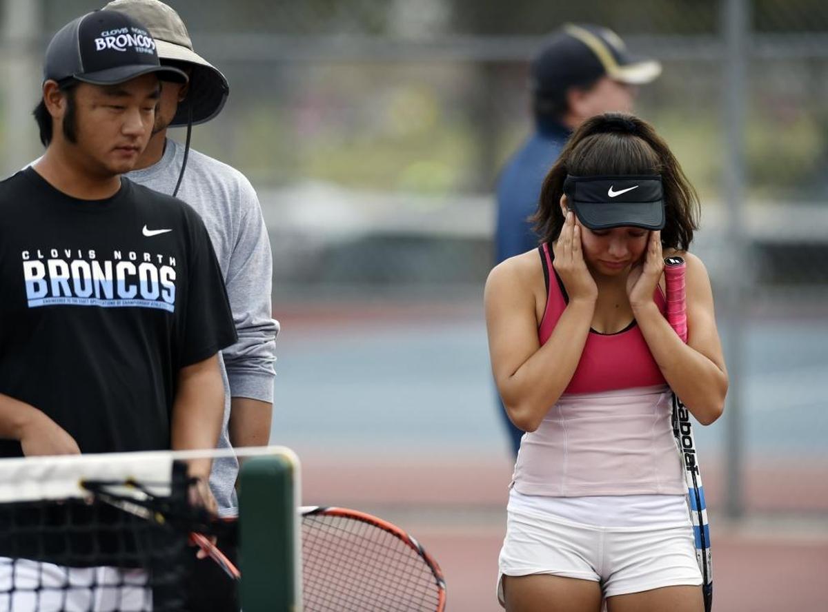 Clovis North’s Tatiana Ruiz, right, walks off the court with a cramp during the Central Section girls tennis singles final against Clovis West’s Janie Ellis Saturday, Nov. 4, 2017 in Clovis. Ellis, the No. 2 seed, beat top-seeded Ruiz for the title.