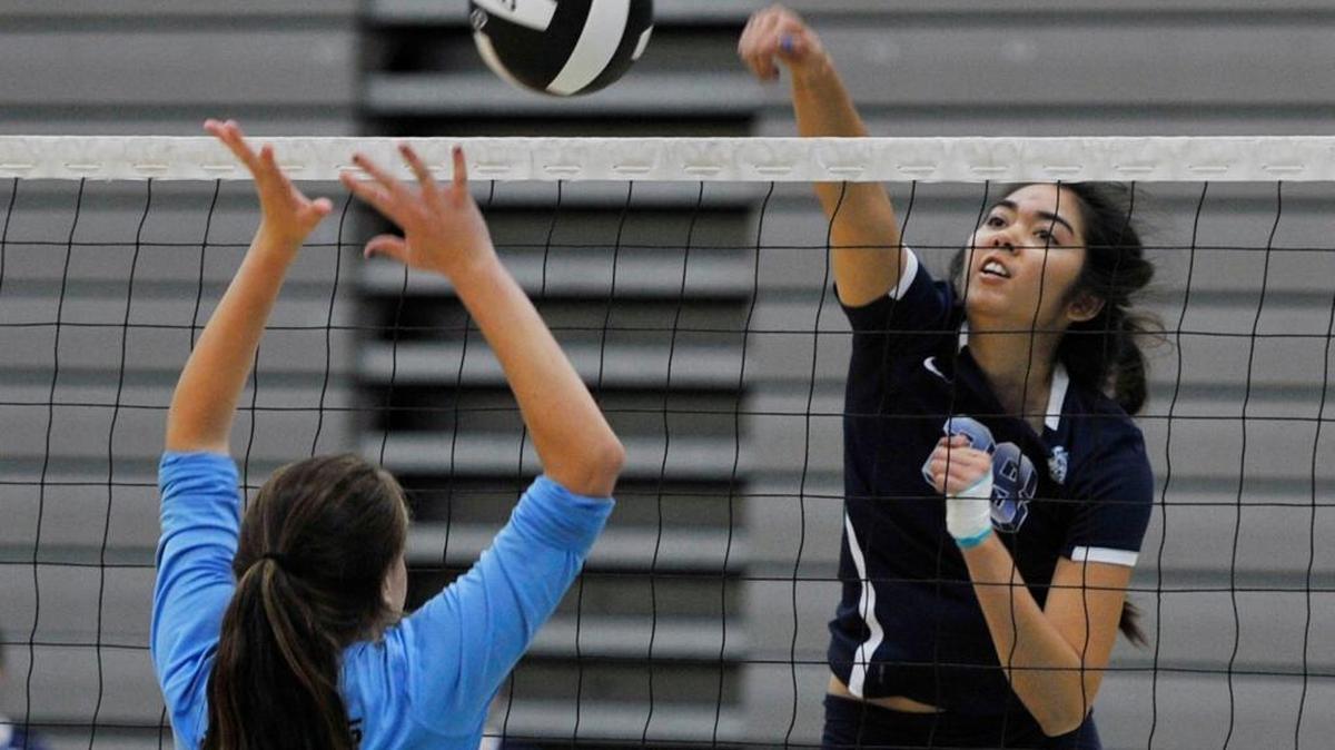 Thaliana Grajeda, right, leads Clovis East into a battle for sole possession of first place in the Tri-River Athletic Conference Tuesday against Clovis West.