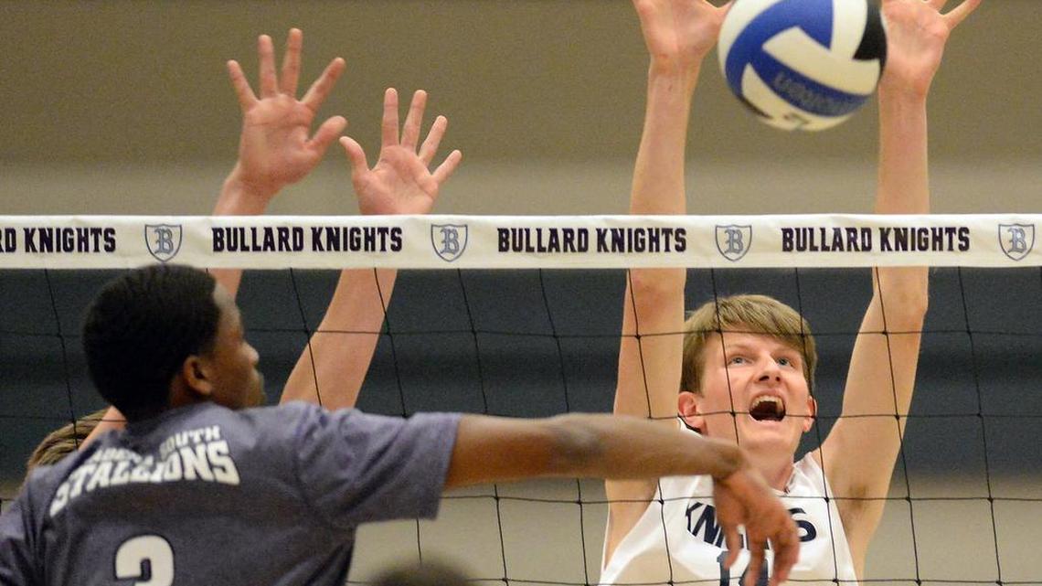 Madera South’s Drew Pearson, left, goes for a kill against Bullard’s Ryan Hovda in a County/Metro Athletic Conference boys volleyball match on Thursday, March 23, 2017, at Bullard High School in Fresno.