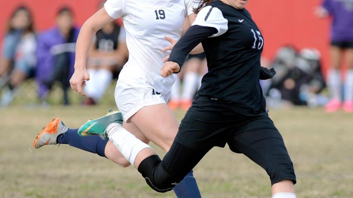 Francesca Aviles-Winn, right, and the Madera South High girls soccer team have elevated to the top of The Bee’s Central Section rankings after beating Nikki Crouch, left, and Clovis East during the final of the Harold S. Young tournament Saturday at Buchanan.