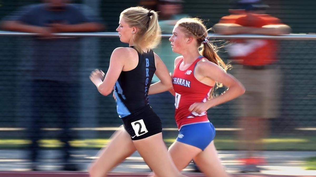 Clovis North High’s Lauren Moffett, left, and Buchanan’s Megan Lowe run step for step during the 3,200 meters at the Central Section’s North Area meet May 11, 2016, at Clovis East. Moffett won in 11:08.63 while Lowe was second in 11:17.29 at a meet that automatically qualifies the top three in each event for the Masters Championships on May 21 at Buchanan’s Veterans Memorial Stadium.