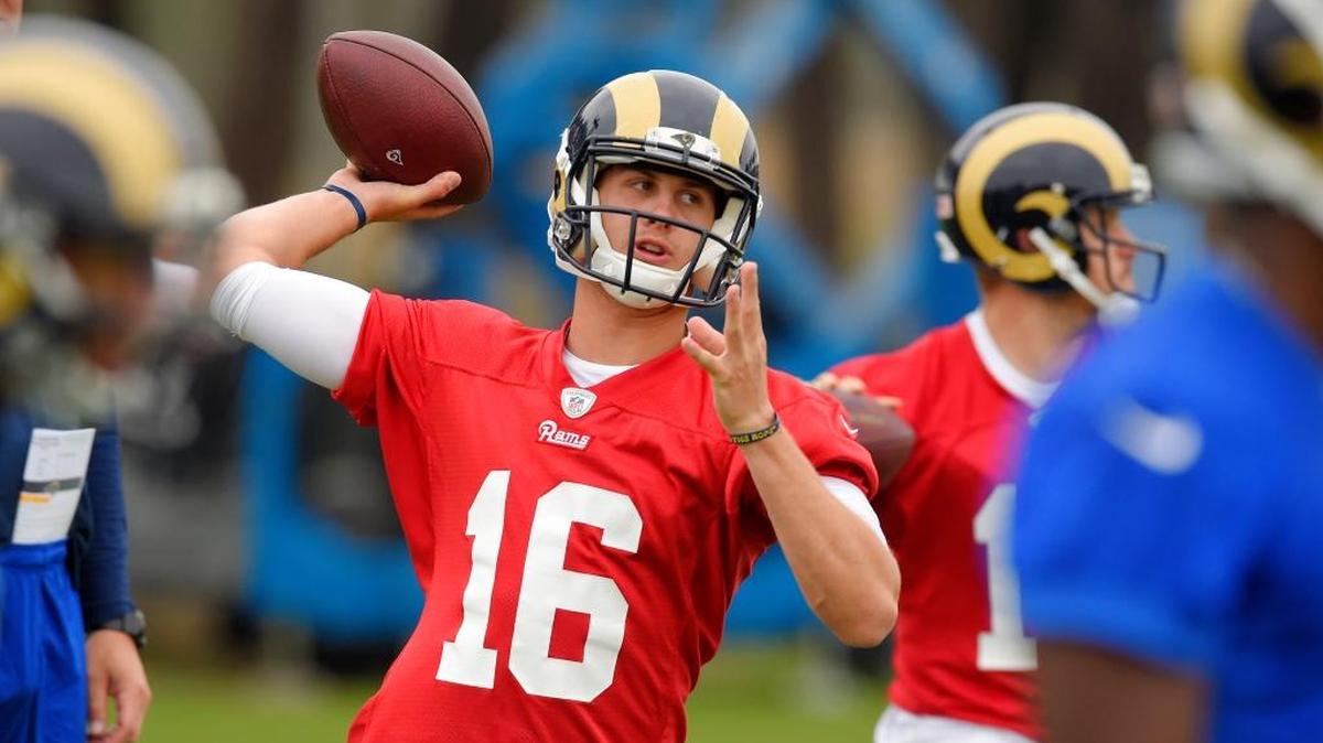 Los Angeles Rams quarterback Jared Goff, left, passes the ball as Los Angeles Rams quarterback Case Keenum also passes during NFL football practice, Tuesday, June 14, 2016, in Oxnard.