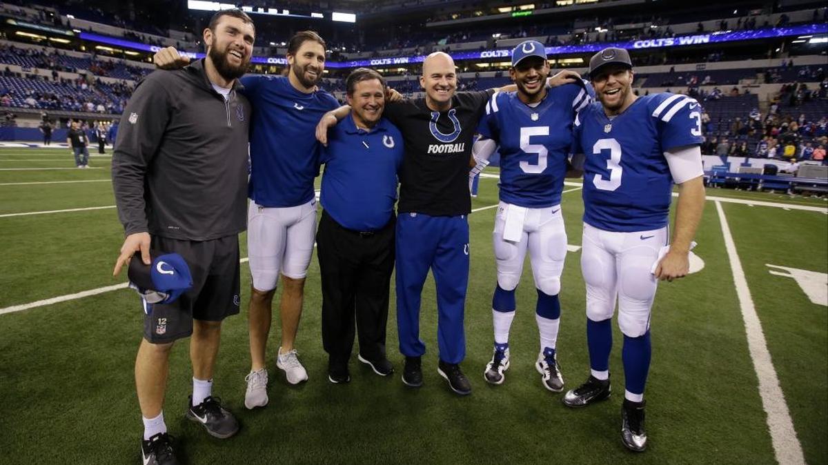Indianapolis quarterbacks Andrew Luck and Charlie Whitehurst, quarterbacks coach Clyde Christensen, and QBs Matt Hasselbeck, Josh Freeman and Ryan Lindley take time for a picture after the Colts beat Tennessee 30-24 on Jan. 3, 2016.