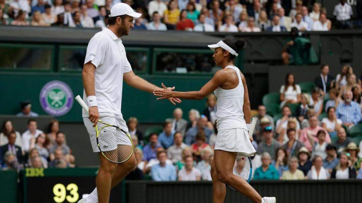Fabrice Martin of France and Fresno native Raquel Atawo get ready for a point in Tuesday’s mixed doubles match at Wimbledon against Serena Williams and Andy Murray.