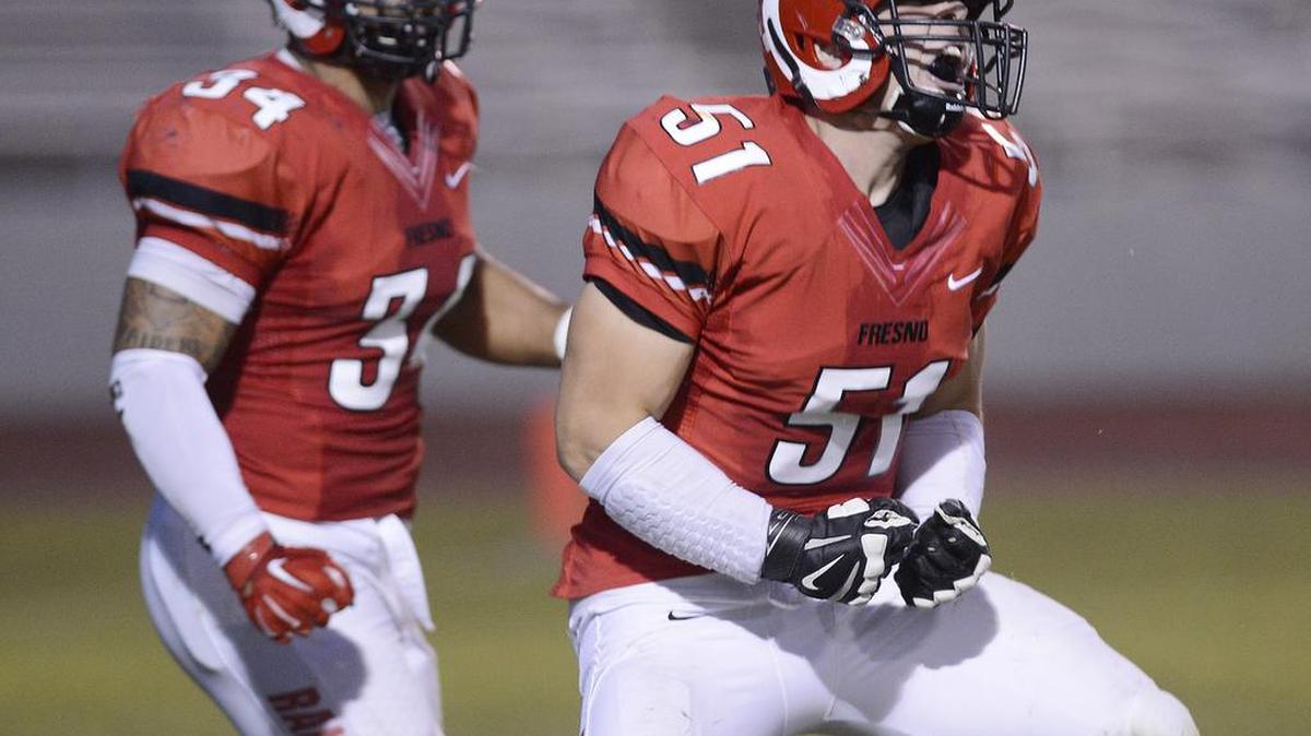
Fresno City’s Josh Hinson – at right celebrating a sack against Reedley last season – says the Rams face a big challenge against City College of San Francisco on Saturday, Sept. 19, 2015, at Ratcliffe Stadium. “They’re consistently good, always ranked and they always have good athletes,” he said. “We just have to play at the level and potential we know we’re capable of.”
