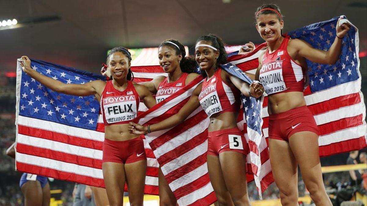 United States' Allyson Felix, Jasmine Todd, English Gardner and Jenna Prandini celebrate after finishing second in the women’s 4x100m relay final at the World Athletics Championships at the Bird's Nest stadium in Beijing, Saturday, Aug. 29, 2015.
