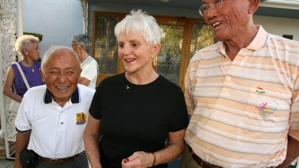 From left, Olympians Dr. Sammy Lee, Pat McCormick and C.K. Yang share a story about Bob Mathias during a memorial for Mathias on Sept. 5, 2006 in Tulare.