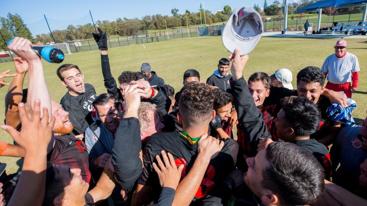 Fresno City College celebrates its first state title after a 2-0 victory over Central Valley Conference foe Taft in Sacramento on Dec. 3, 2017.