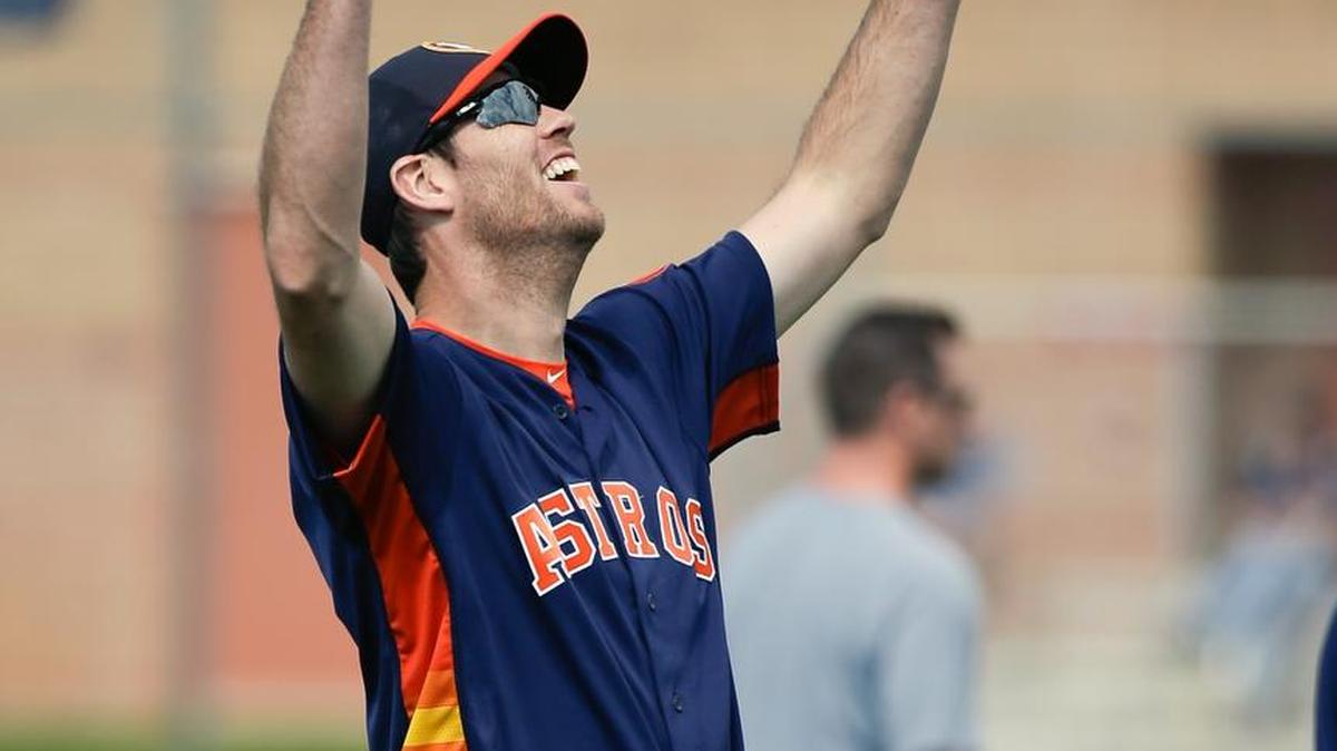 Houston Astros pitcher Doug Fister is all smiles as he stretches during a spring training baseball workout Friday, Feb. 19, 2016, in Kissimmee, Fla. The eight-year veteran is in his first season with Houston after spending the last two years with the Washington Nationals.