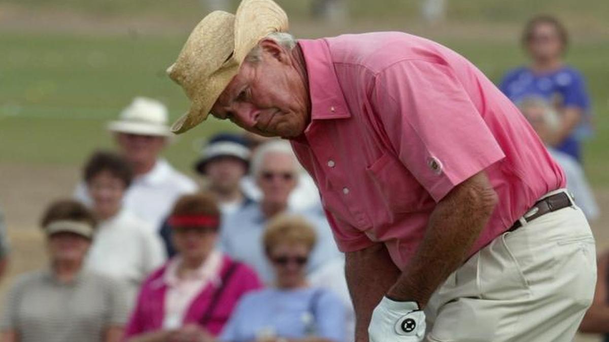 Arnold Palmer putts on the first green during the SaveMart Shootout at Riverbend Golf Club on Monday, Oct. 14, 2002.