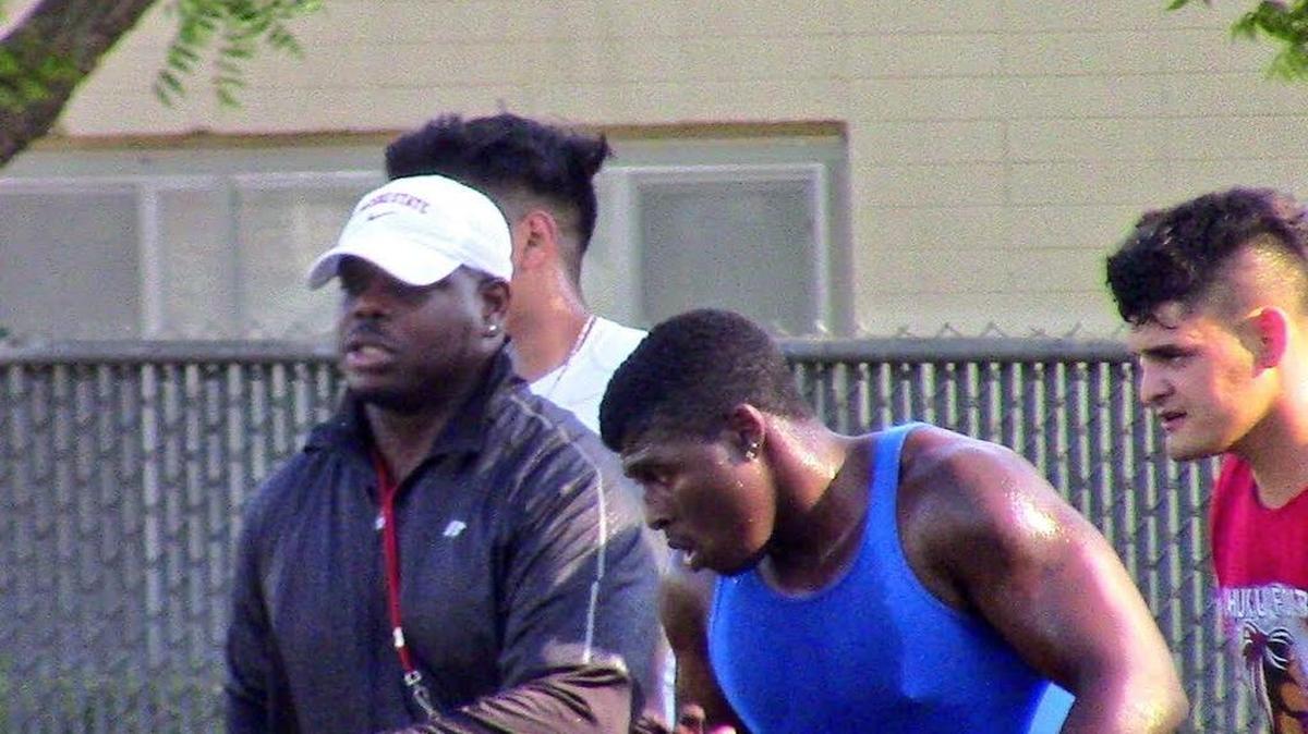 Former West Hills and Fresno State running back Dwayne Wright, left, was hired to be the inside linebackers coach at Fresno City College.