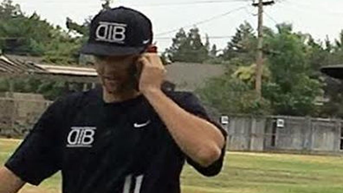 Central High’s Justin Miller talks with a Philadelphia Phillies representative after he was selected in the 12th round of baseball’s June 2016 amateur draft. Where was he when the pros came calling? On the mound, of course, pitching for a summer travel team.