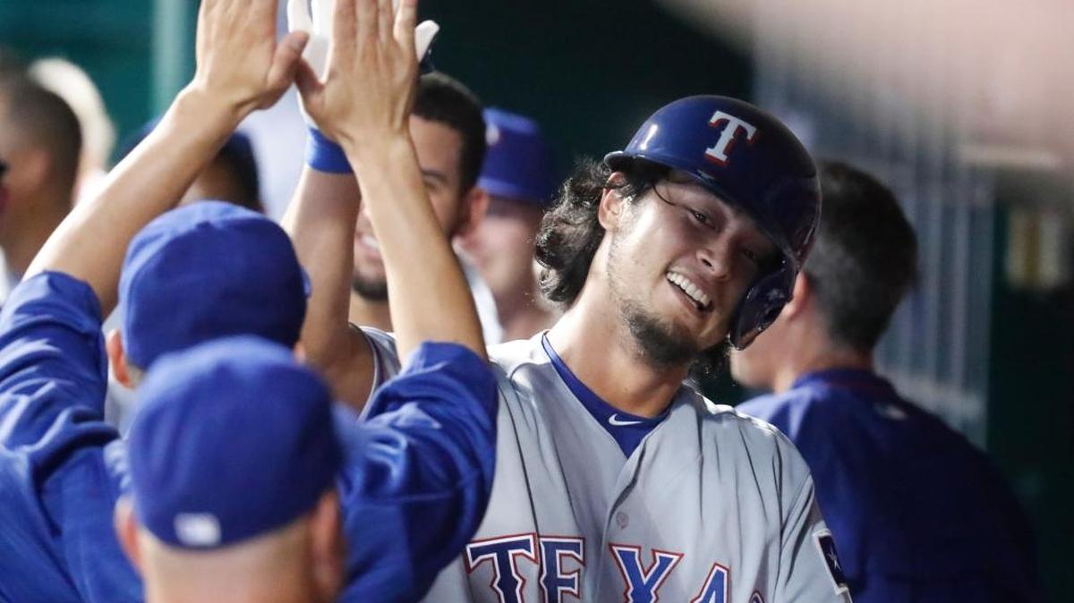 Yu Darvish celebrates his solo home run on Wednesday in Cincinnati.