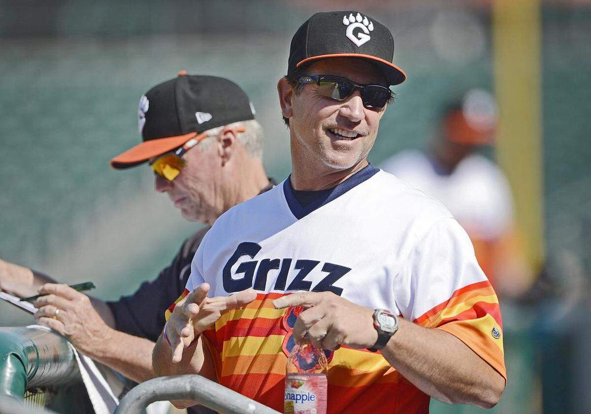 Fresno Grizzlies manager Tony DeFrancesco, in an alternate jersey, smiles at a fan during a 2015 game, the inaugural season as a Houston Astros affiliate.