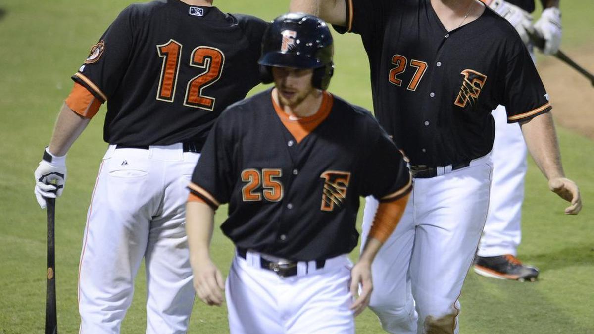 
The Grizzlies and Tyler White – at right with Alex Presley, center, and Max Stassi, left, after scoring on a Nolan Fontana hit against Albuquerque at Chukchansi Park Saturday, Aug. 1, 2015 – are home for the final eight games of the regular season followed by the first two games of their PCL playoff series against El Paso or Las Vegas.
