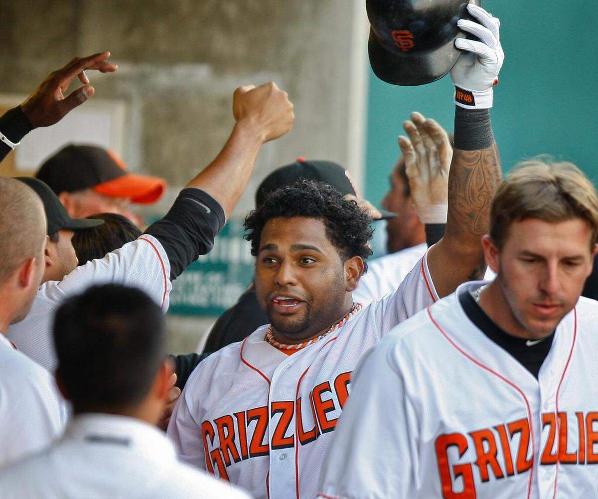 Pablo Sandoval, center, is congratulated by Fresno Grizzlies teammates after homering during a 2011 game. Sandoval was on a rehabilitation assignment.
