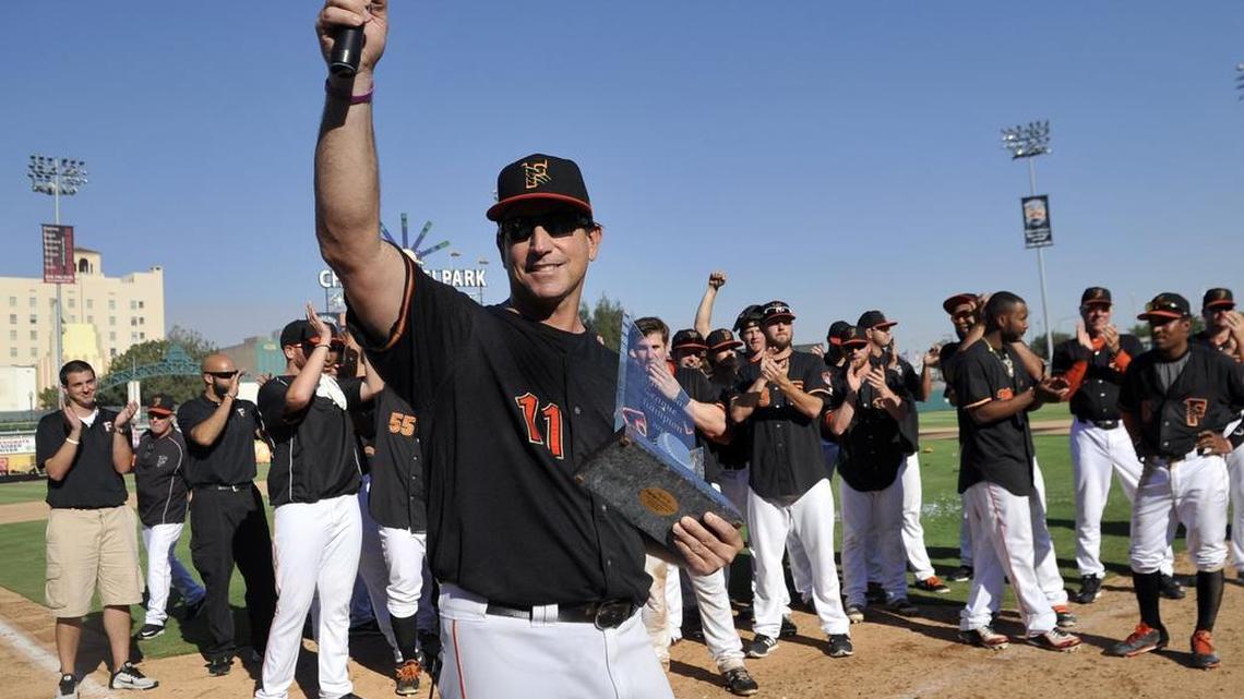 
Fresno Grizzlies manager Tony DeFrancesco raises his arm to the stands after the Grizzlies win the PCL championship with a 7-3 victory in the finale of the best-of-five against the Round Rock Express on Sept.20, 2015, at Chukchansi Park.

