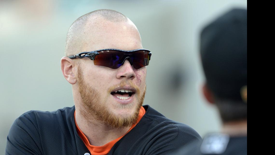 
Pitcher Brett Oberholtzer, who is on the Fresno Grizzlies roster after being optioned to the team by the Astros, talks to players in the Grizzlies dugout before the start of ’Monday's game against Tacoma.
