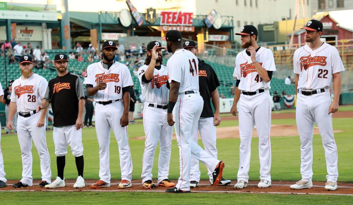 Fresno Grizzlies outfielder/designated hitter Yordan Álvarez greets fellow starters prior to the 2018 Pacific Coast League divisional series playoff opener.