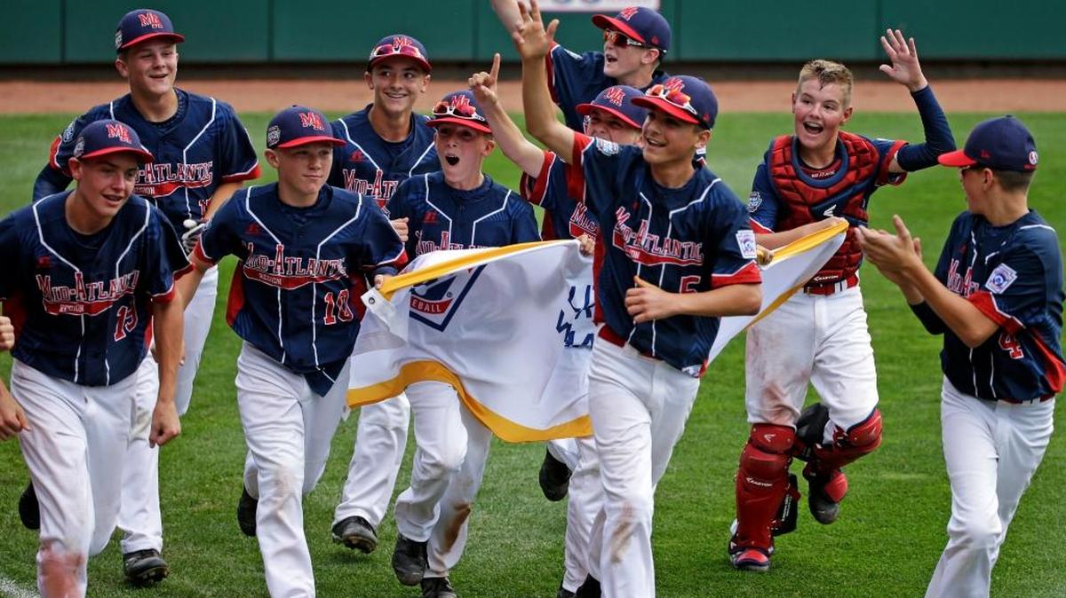 The kids from Endwell, N.Y., take a victory lap after beating South Korea on Sunday for the Little League World Series title in South Williamsport, Pa.
