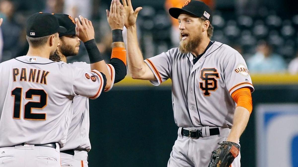 Hunter Pence, right, Joe Panik, Brandon Crawford and the Giants sit atop the National League Wild Card standings.