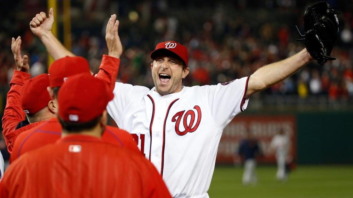 Nationals starter Max Scherzer celebrates with his teammates after striking out 20 batters in a win over the Detroit Tigers on Wednesday, May 11, 2016, in Washington.
