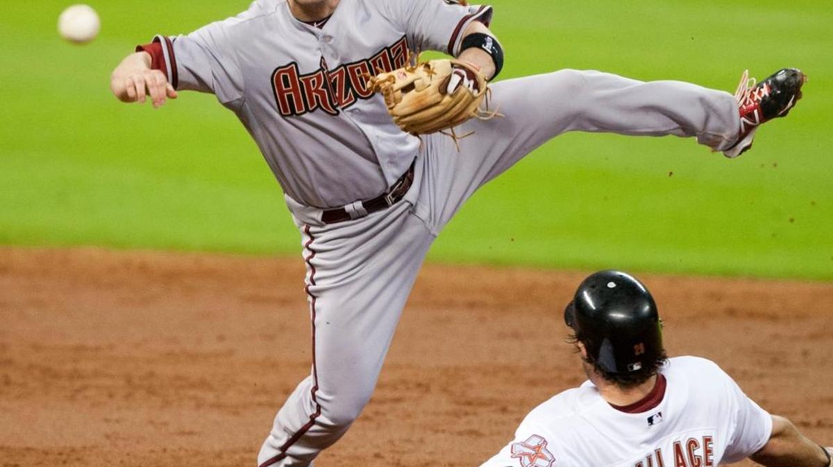 Arizona Diamondbacks second baseman Aaron Hill attempts to complete a double play against Houston on Saturday, Aug. 18, 2012. The 12-year major league veterans has signed a minor league deal with the San Francisco Giants ahead of the 2017 season.
