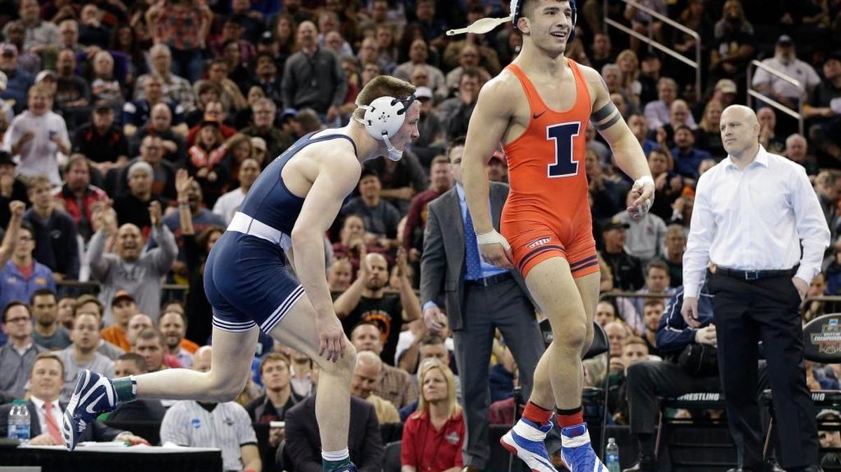 Illinois’ Isaiah Martinez jumps up off the mat as time winds off the clock in his win over Penn State’s Jason Nolf in the 157-pound championship match of the NCAA Division I Championships on Saturday in New York. The former Lemoore High star won his second consecutive individual title 6-5.