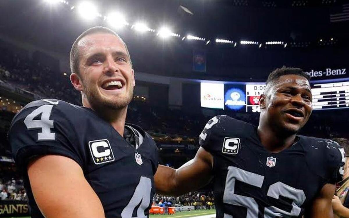 Raiders quarterback Derek Carr celebrates with defensive end Khalil Mack after Oakland beat New Orleans last season.