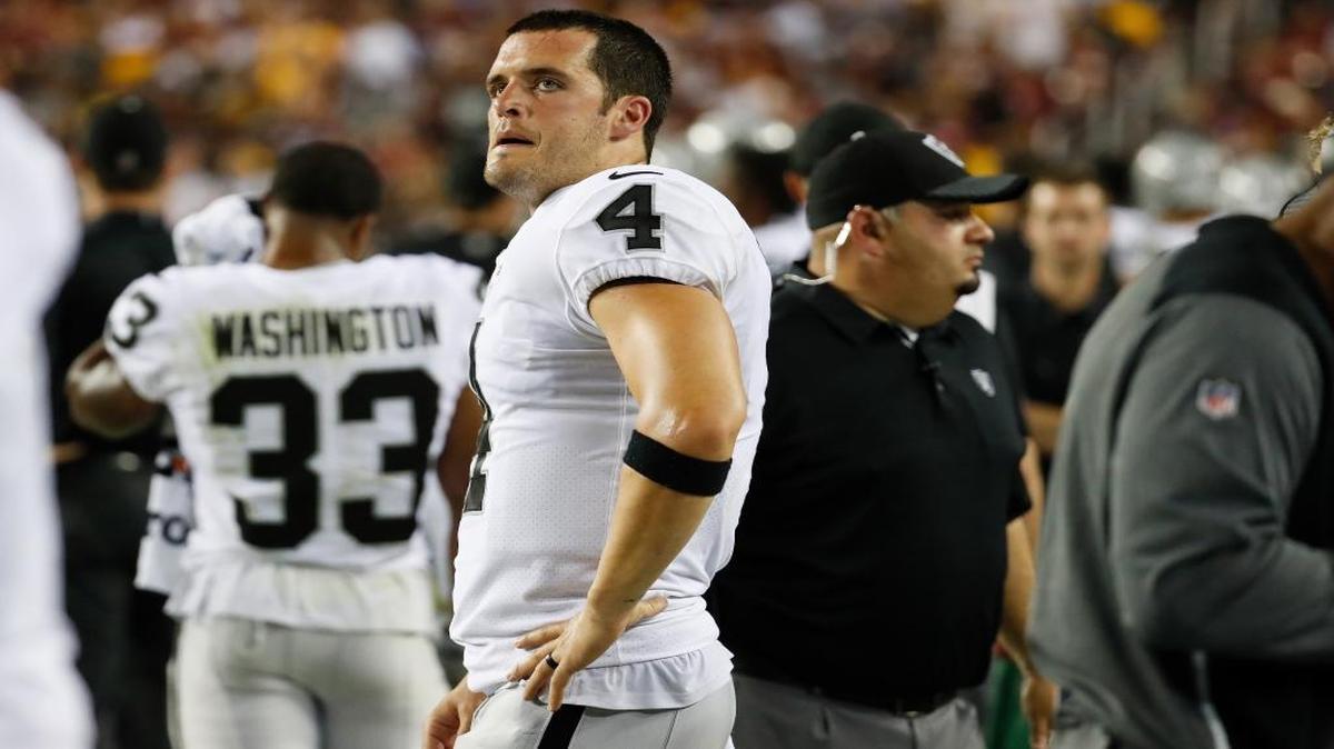 Oakland Raiders quarterback Derek Carr (4) looks up at the scoreboard during the second half of an NFL football game against the Washington Redskins in Landover, Md., Sunday, Sept. 24, 2017.