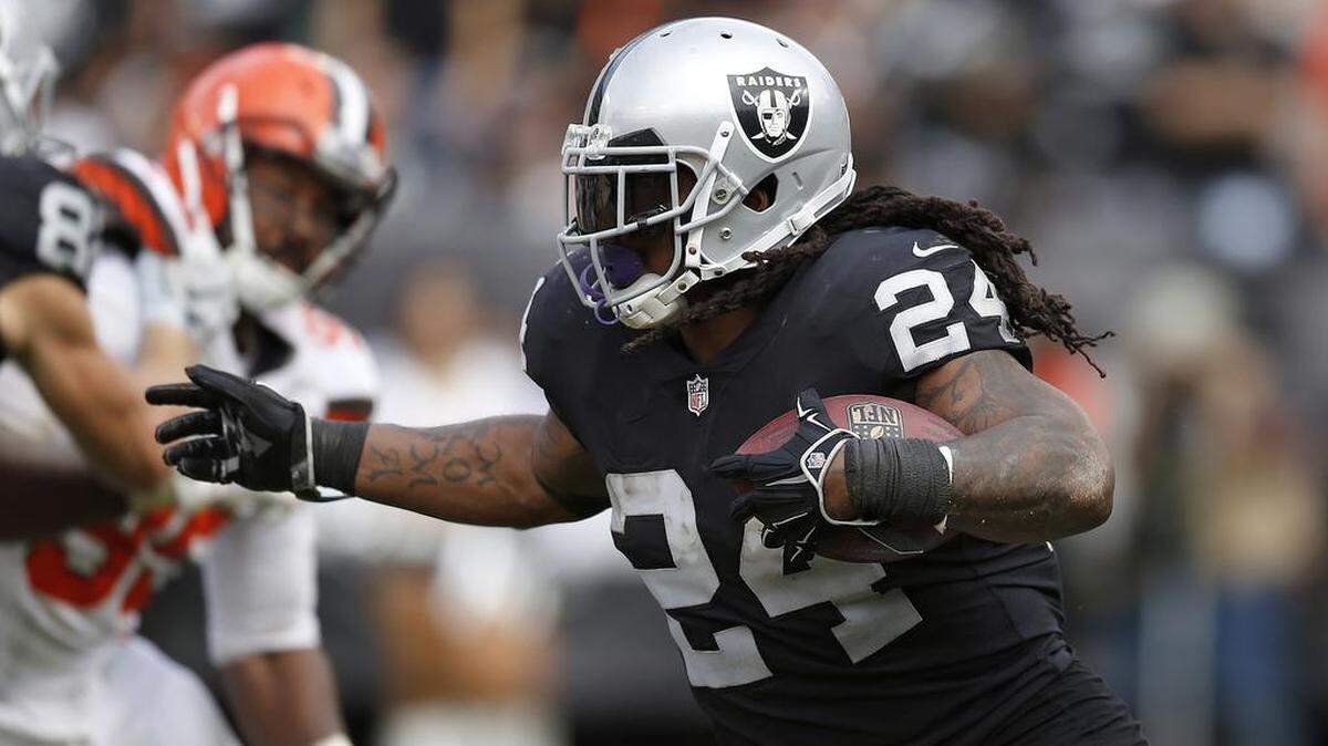 FILE - In this Sept. 30 2018, file photo, Oakland Raiders running back Marshawn Lynch (24) carries against the Cleveland Browns during an NFL football game in Oakland, Calif. Oakland may always be home for Lynch but Seattle was the city that truly made him a star. The Seahawks (2-3) will get an up-close look at Lynch again this week for the first time since he retired following the 2015 season when they travel to London to face the Raiders (1-4).