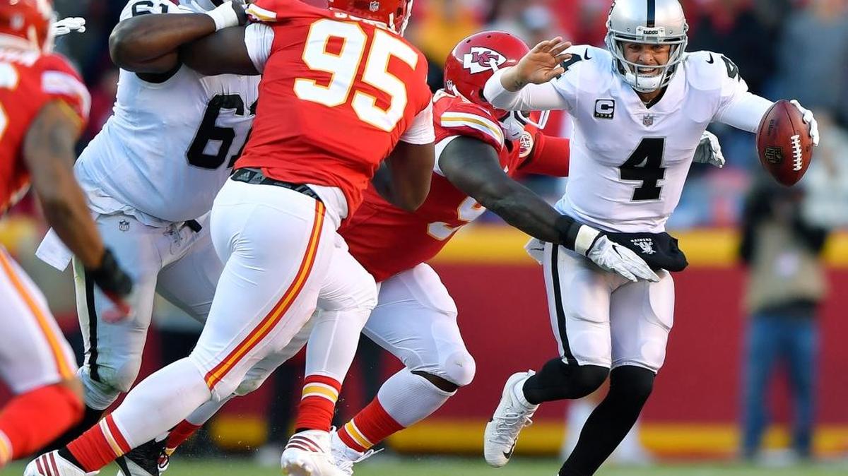 Kansas City Chiefs defensive tackle Jarvis Jenkins sacks Oakland Raiders quarterback Derek Carr in the third quarter on Sunday, Dec. 10, 2017 at Arrowhead Stadium in Kansas City, Mo.