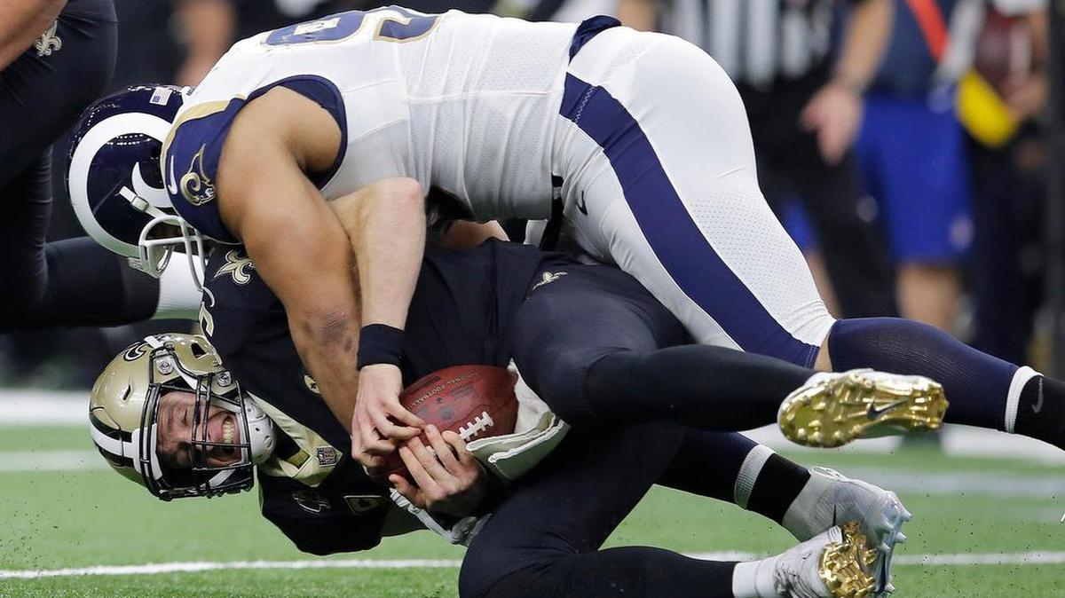 Los Angeles Rams defensive lineman Ndamukong Suh sacks New Orleans Saints quarterback Drew Brees in the NFC championship game.