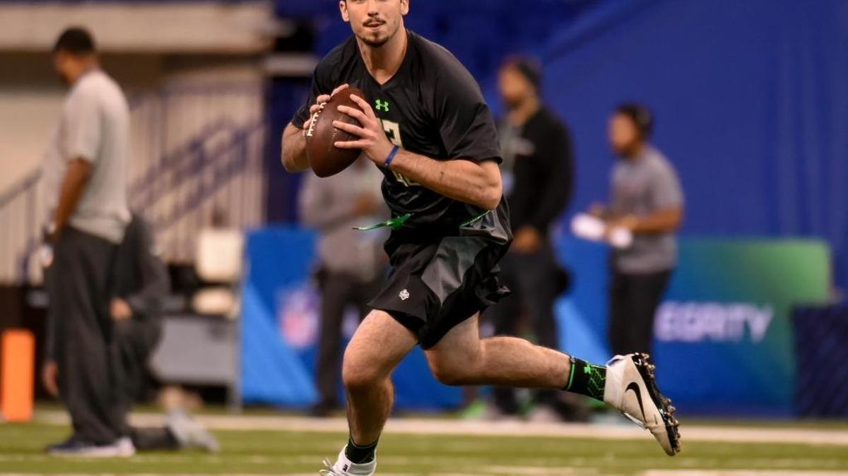 In this Feb. 27, 2016 file photo, Memphis quarterback Paxton Lynch runs a drill at the NFL football scouting combine, in Indianapolis. The facts about Braxton Miller's potential NFL career are clear: a transition from star quarterback at Ohio State to maybe wide receiver as a pro. He's sharing the journey with fans through a 360-degree virtual reality video. Not to be outdone, Paxton Lynch, who will be playing quarterback in the NFL and quite possibly will be a first-round pick in Thursday night's draft, is taking the same VR route.