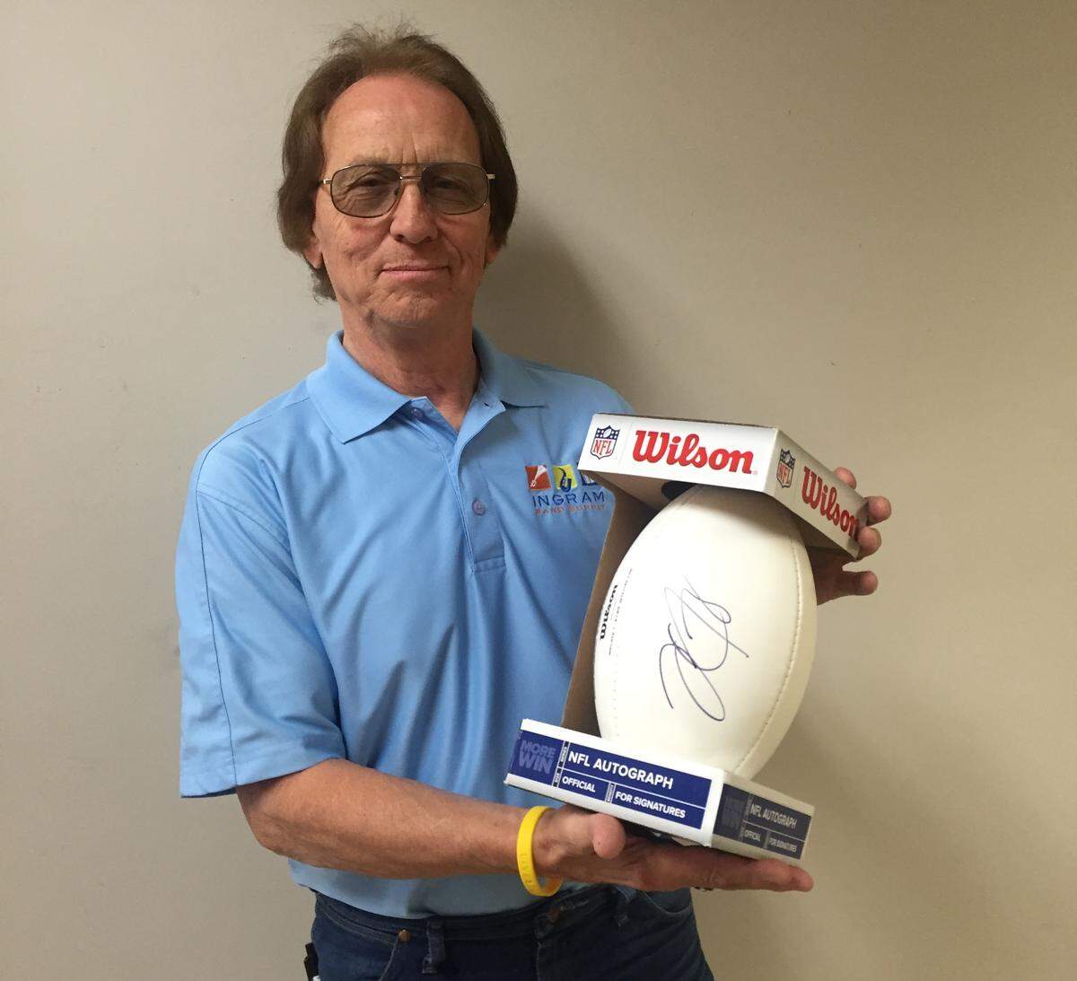 Bill Ingram with his David Carr-autographed football