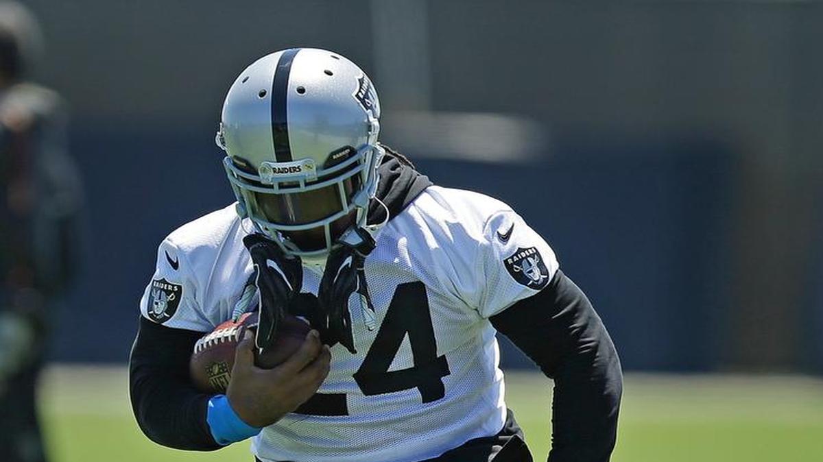Oakland Raiders' Marshawn Lynch runs a drill during NFL football practice on Tuesday, June 13, 2017, at the team's training facility in Alameda.