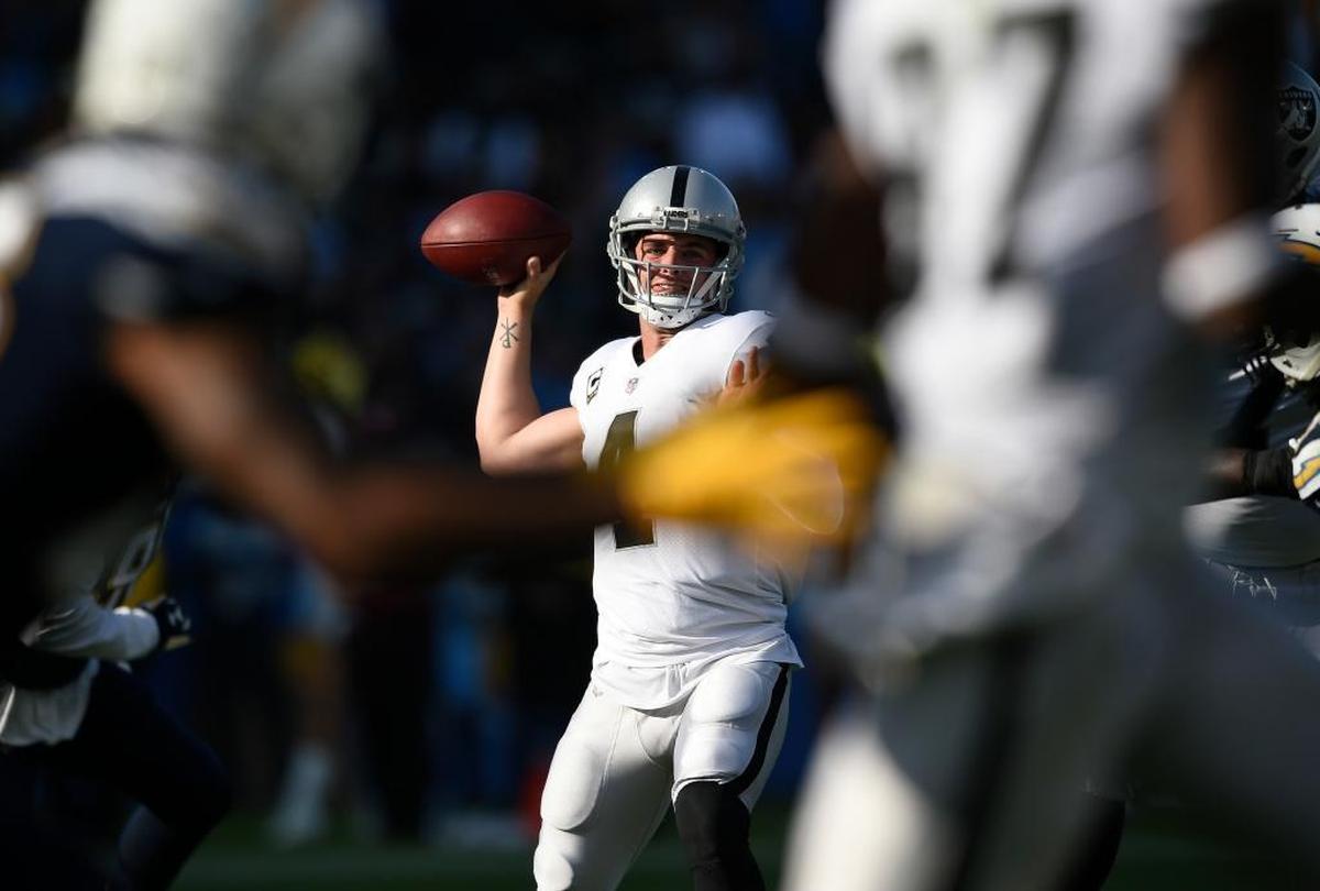 Raiders quarterback Derek Carr throws a pass during the first half of a 30-10 loss to the Los Angeles Chargers, Sunday, Dec. 31, 2017, in Carson. Carr completed 19 of 28 passes for 243 yards with one touchdown and one interception.