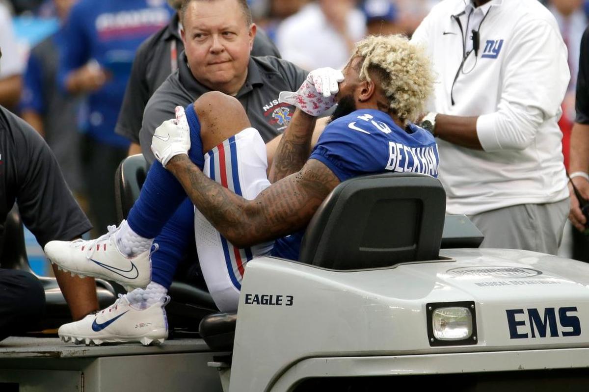 New York Giants wide receiver Odell Beckham is taken off the field on a cart after an injury during the second half of an NFL football game against the Los Angeles Chargers, Sunday, Oct. 8, 2017, in East Rutherford, N.J.