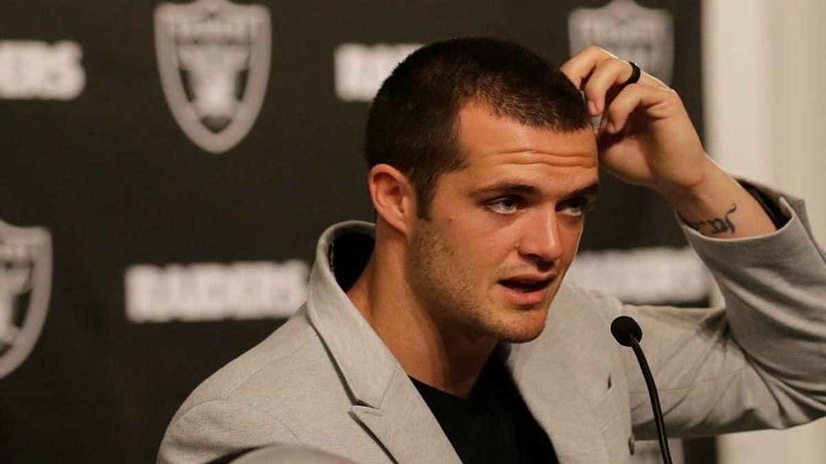 Oakland Raiders quarterback Derek Carr may look like he’s trying to figure out where he can borrow a buck, but in reality he has plenty after signing a $125 million contract extension Friday, June 24, 2017.