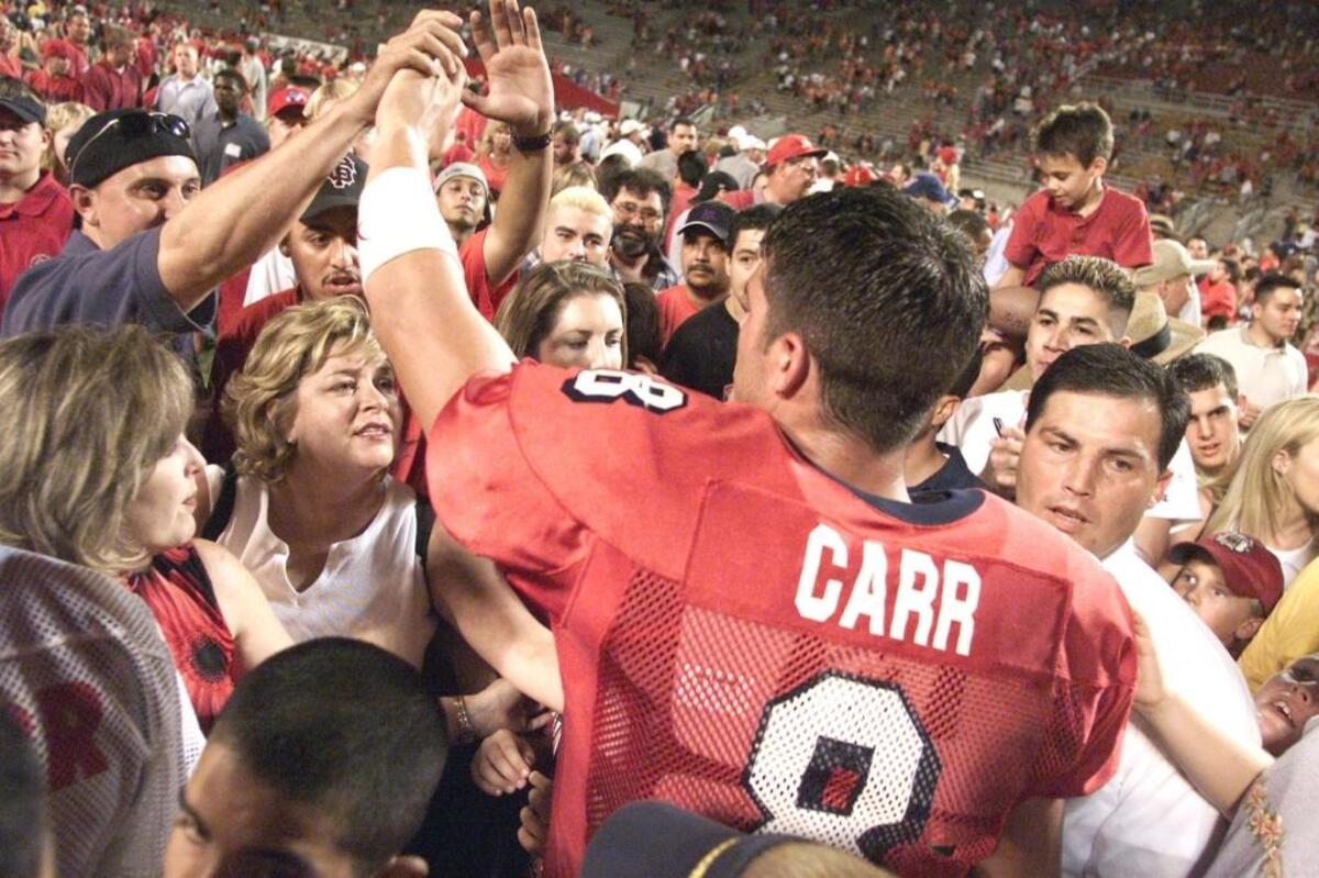 Quarterback David Carr celebrates with fans after Fresno State beat No. 10 Oregon State 44-24 in 2001. The Beavers were the highest ranked team to play at Bulldog Stadium at that time.