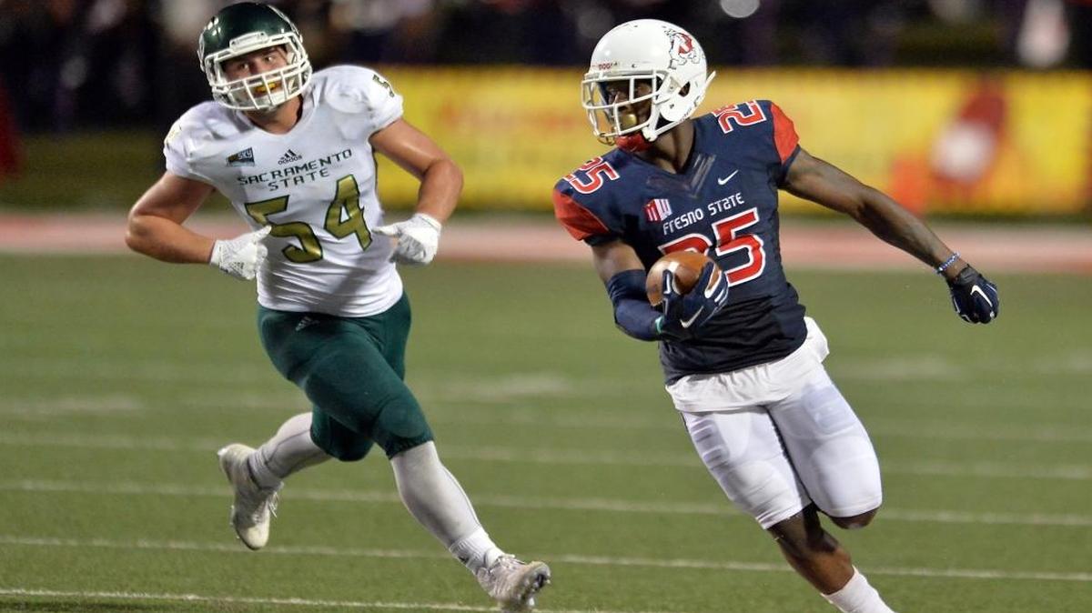 Fresno State’s Tyquwan Glass, right, gets ahead of Sacramento State’s Tyler Meteer during the 2016 home season-opener at Bulldog Stadium. Glass signed a contract with the Los Angeles Rams on Tuesday, Aug. 22, 2017.